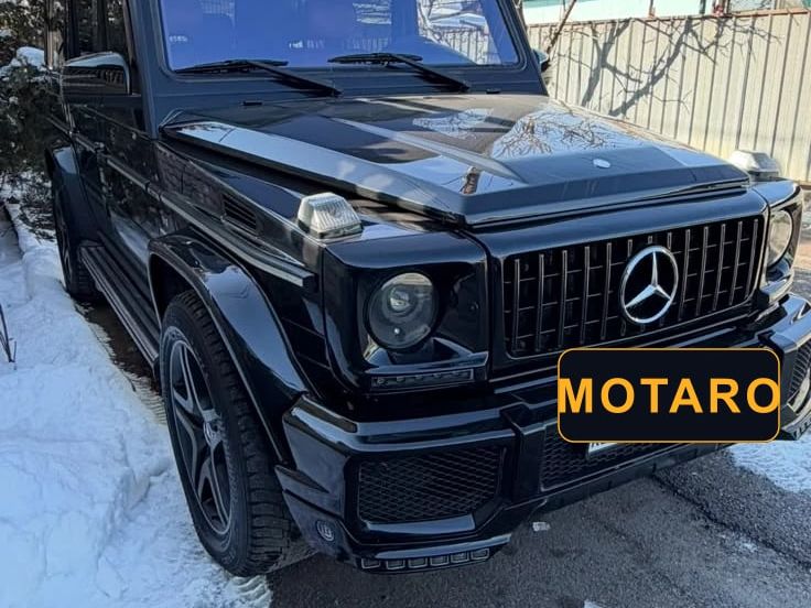 Чёрный Mercedes-Benz G 55 AMG 2008 года, вид спереди сбоку